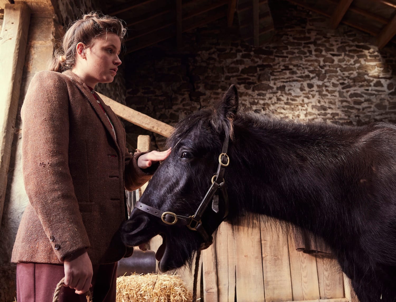 Picture shows: A thoughtful Jenny Alderson (Imogen Clawson) in the stable with her beloved pony.
