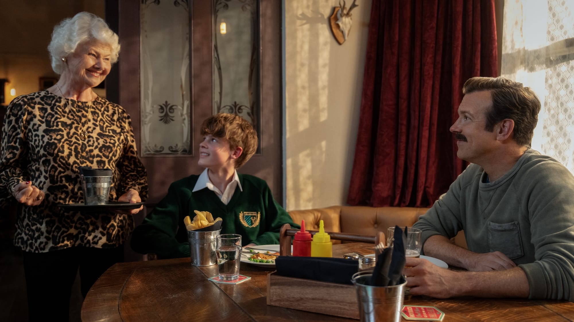 Annette Badland, Grant Feely and Jason Sudeikis in "Ted Lasso" Season 4