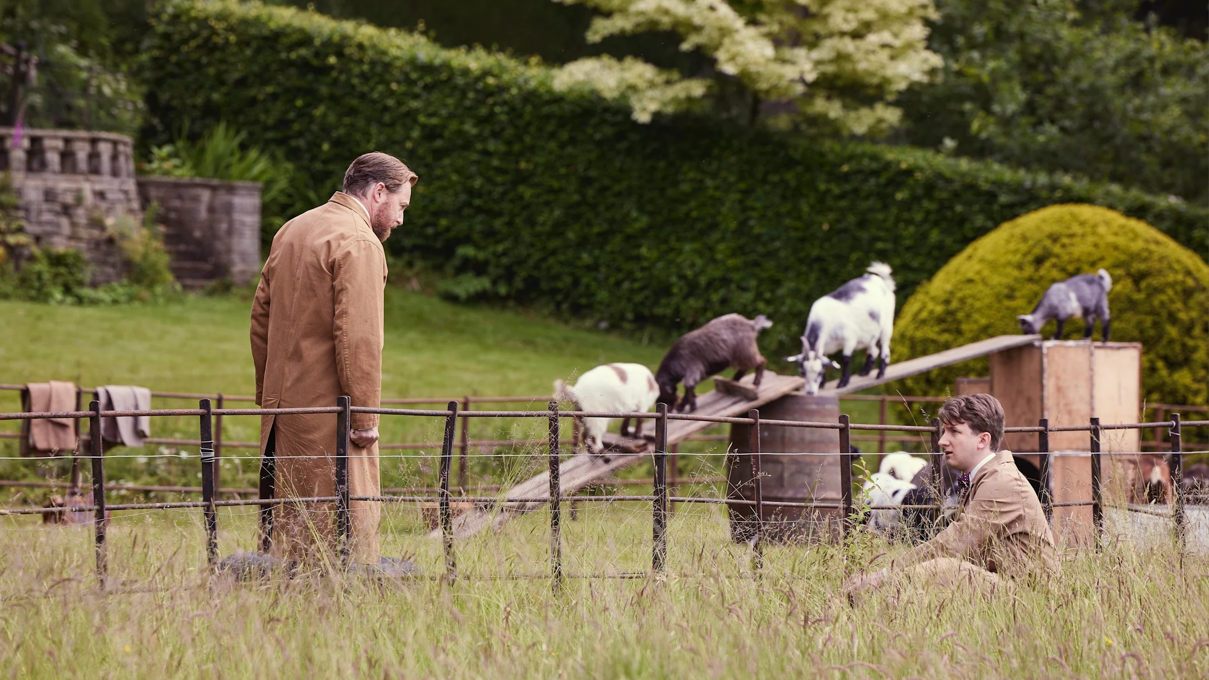 Siegfried Farnon (Samuel West) and Richard Carmody (James Anthony-Rose) inspect Miss Grantley's goats.