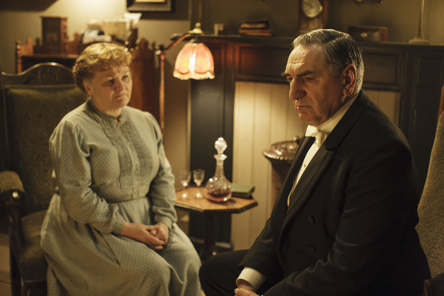 Carson (Ted Carter) seeks marital advice from Mrs. Patmore (Lesley Nichol) over a glass of sherry. 