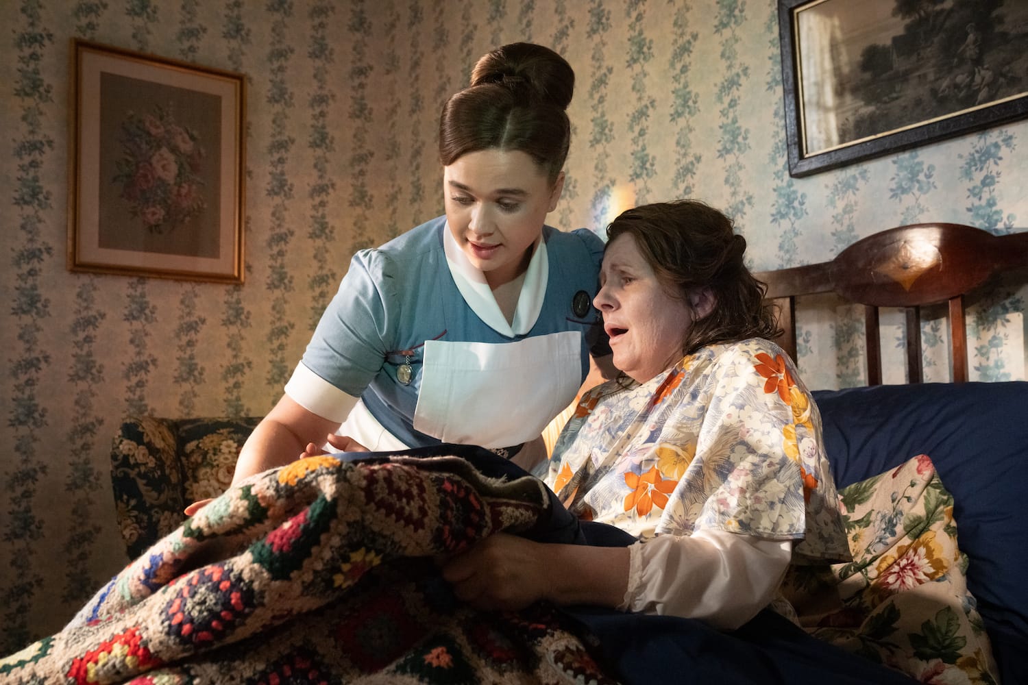 Nurse Nancy Corrigan (Megan Cusack) tends to patient Olive Macketts (Clare Burt).