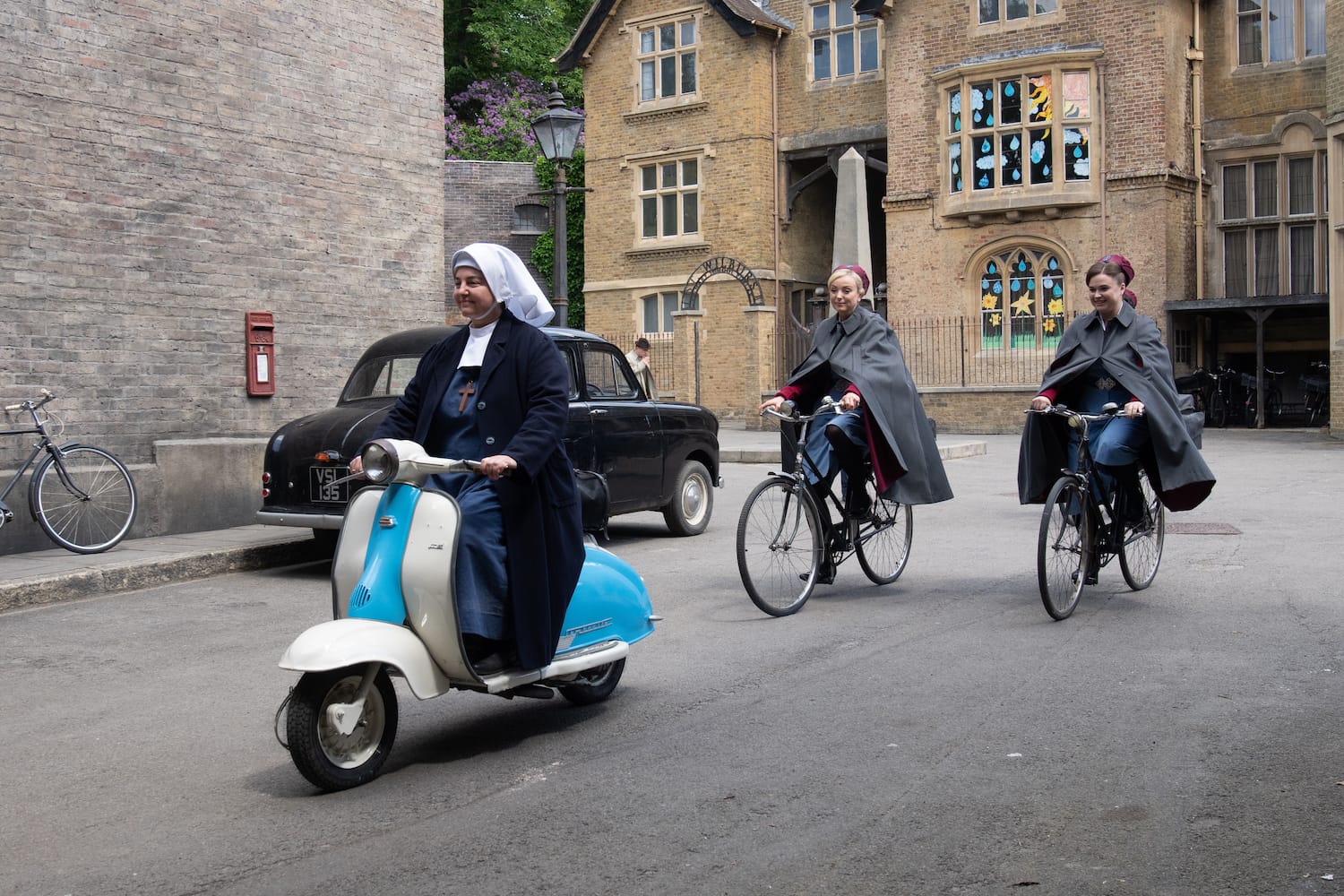 Sister Veronica (Rebecca Gethings) leads the way on her new scooter, followed by Nurse Trixie Franklin (Helen George) and Nurse Phyllis Crane (Linda Bassett).