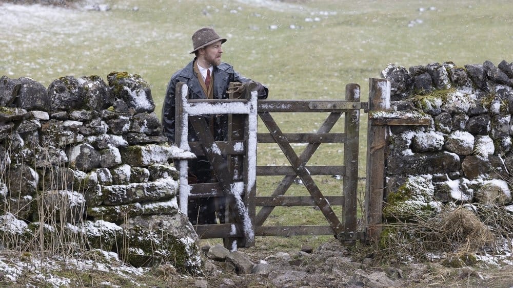 Samuel West as Siegfried Farnon in the snow in All Creatures Great &amp; Small Season 4