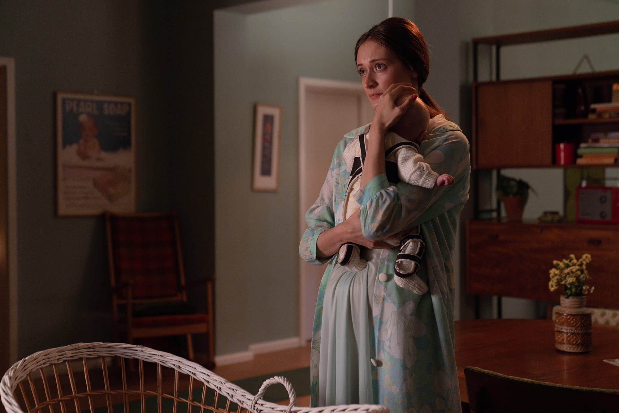 Mia Gill as new mother Gillian Baxter holding her child in 'Call the Midwife' Season 13