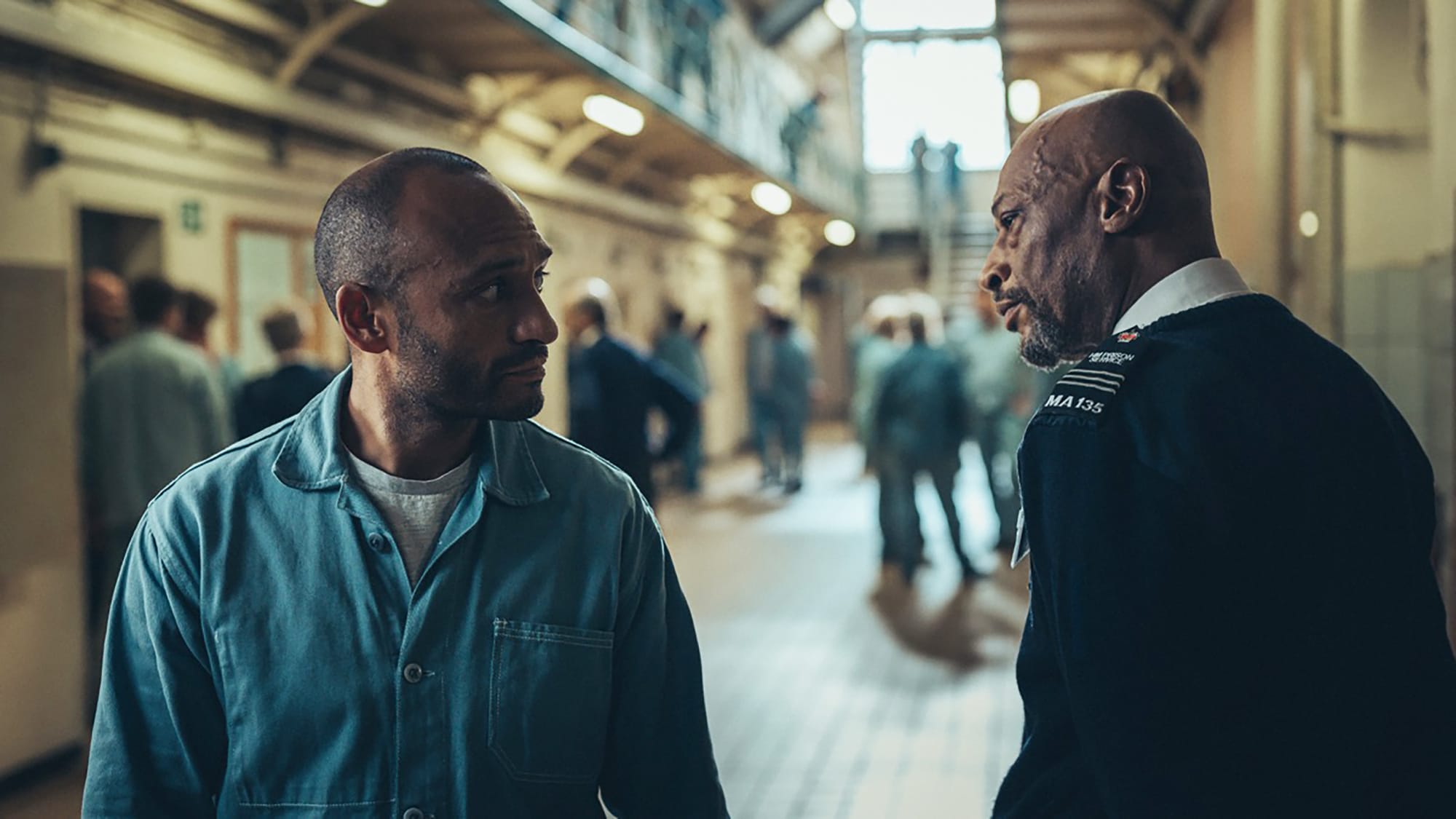 Chris Ryman as Omar Haq and Terence Maynard as Prison Officer Levi Burridge in 'Professor T' Season 3