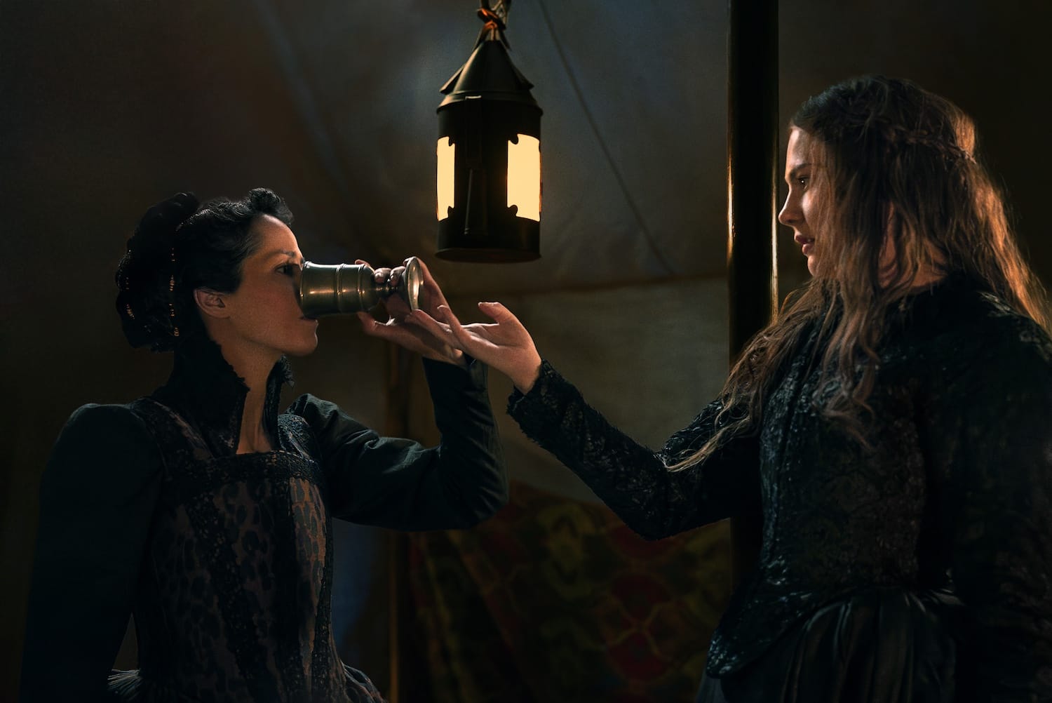Edith (Isobel Jesper Jones) forces Aabis (Amrita Acharia) to drink the poisoned wine.