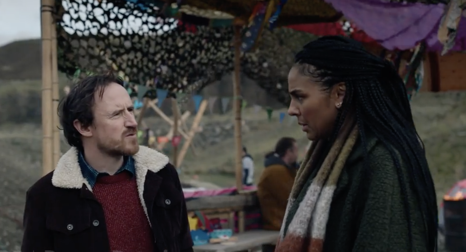 Henry Wicks (Ben Crompton), leader of Planet Resistance, shows Shadow Environment Secretary and Labour Party MP Francine Bridge (Marsha Thomason) around the encampment.