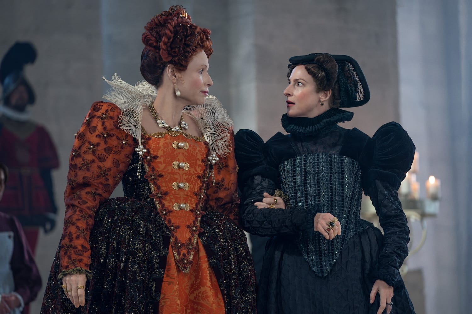 Queen Elizabeth I of England (Minnie Driver) charms––or bullies––Jeanne d’Albret (Rosalie Craig).