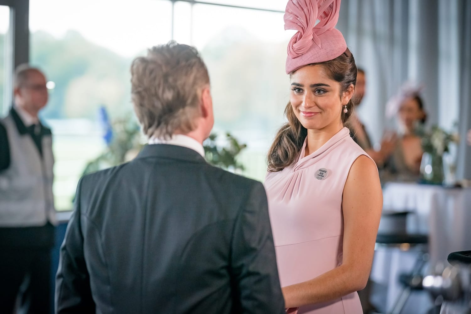 PM Robert Sutherland (Robert Carlyle) chats with Princess Yadira Bint Zyan Al-Bilal (Yasmin Al-Khudhairi) at Ascot.
