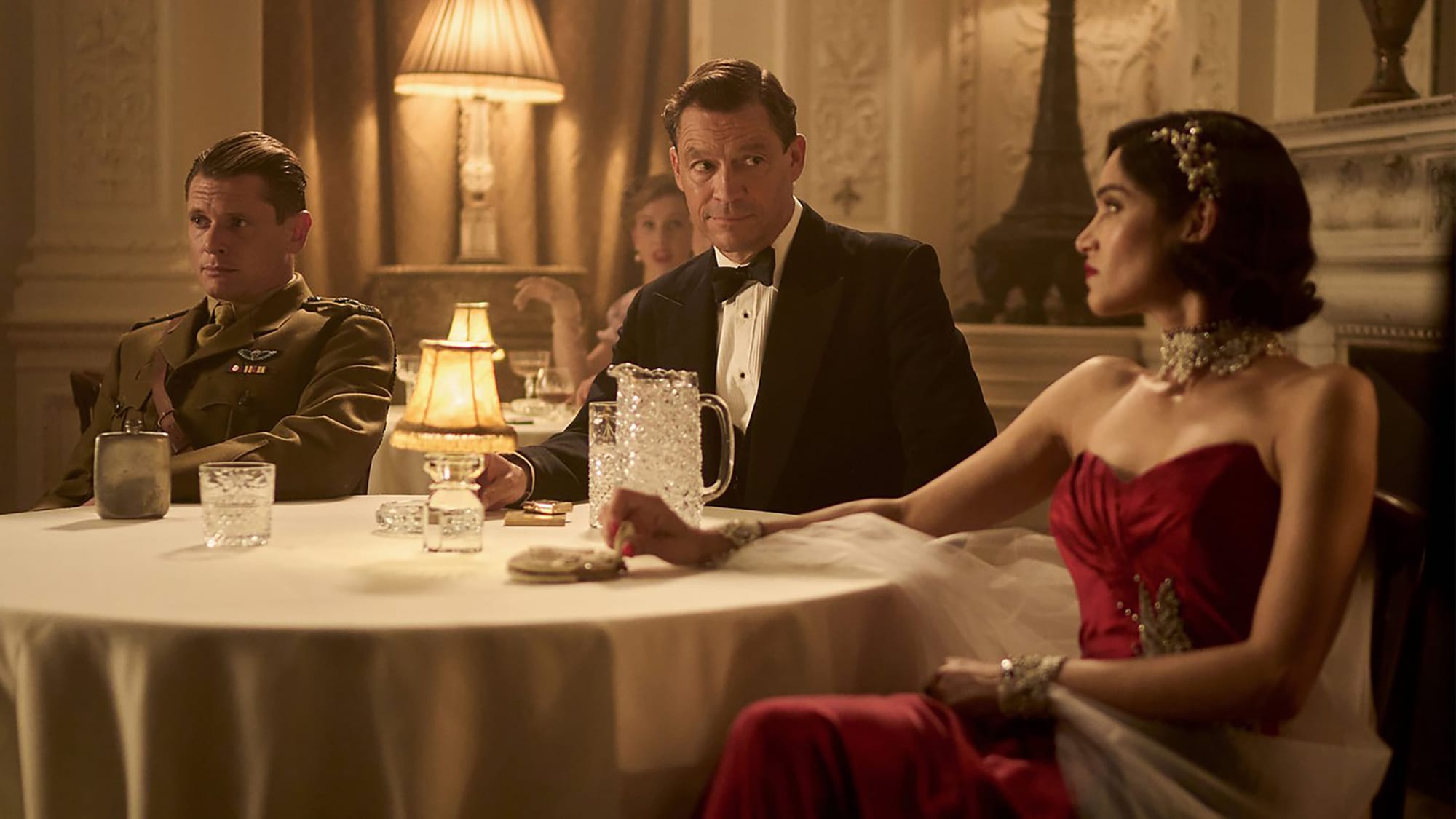 Jack O’Connell as Paddy Mayne, Dominic West as Dudley Clarke, and Sofia Boutella as Eve Mansour in 'Rogue Heroes'