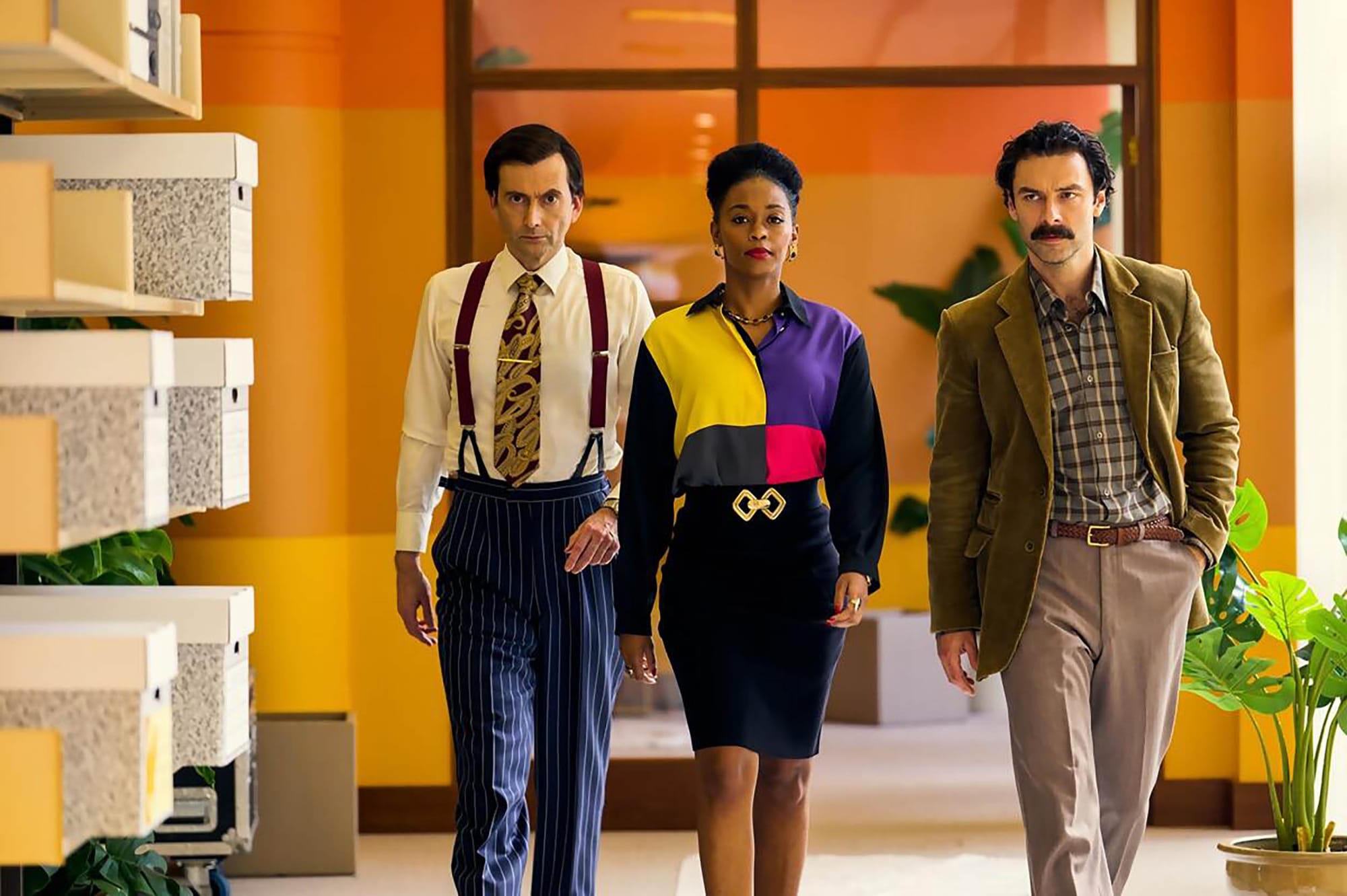 David Tennant as Lord Tony Baddingham, Nafessa Williams as Cameron Cook and Aidan Turner as Declan O'Hara in 'Rivals'