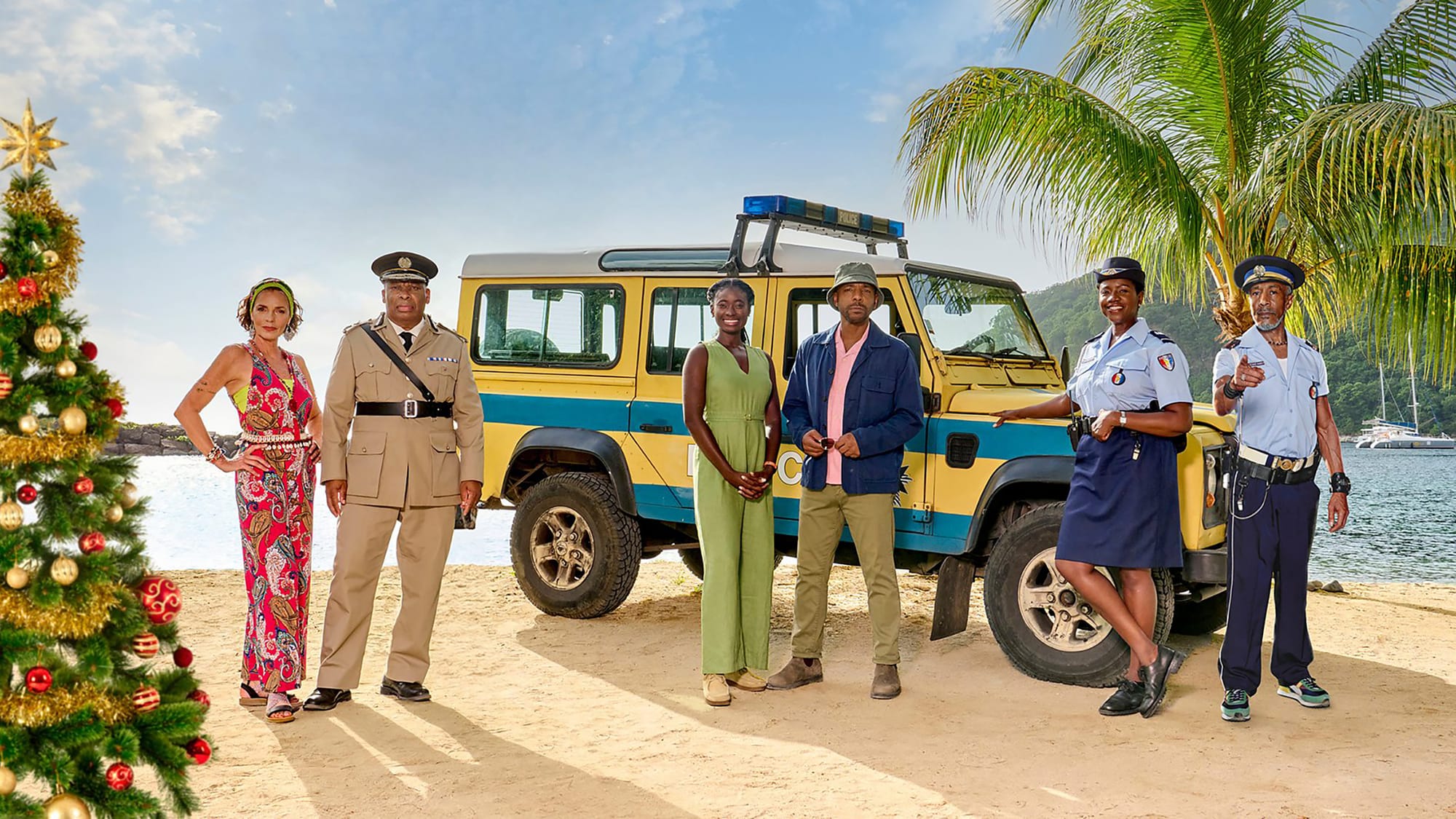 Élizabeth Bourgine as Catherine Bordey, Don Warrington as Commissioner Selwyn Patterson, Shantol Jackson as DS Naomi Thomas, Don Gilet as DI Mervin Wilson, Ginny Holder as Officer Darlene Curtis, and Danny John-Jules as Officer Dwayne Myers in the 'Death in Paradise' 2024 Festive Special