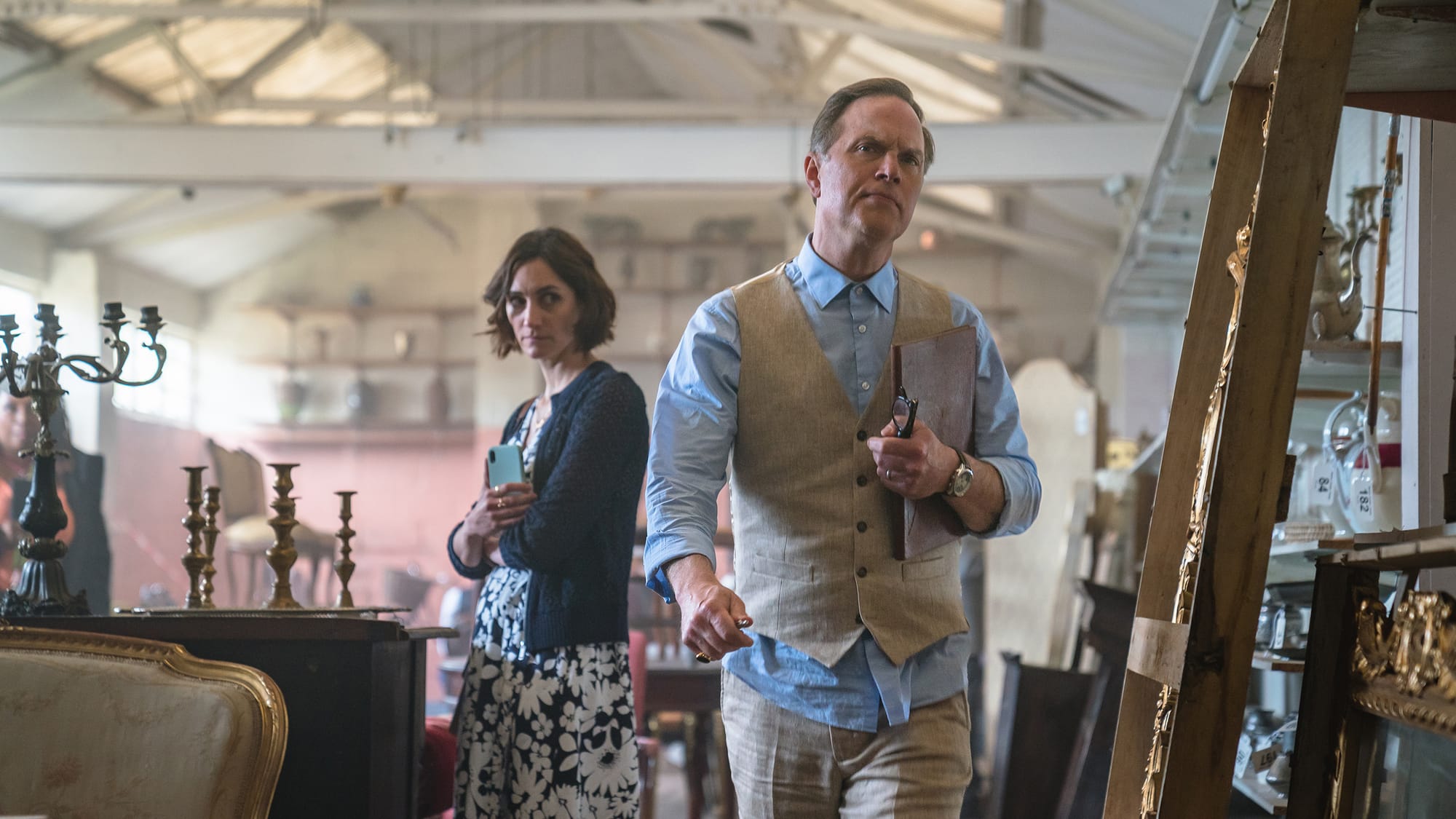 Cara Horgan as Becks Starling and Daniel Lapaine as Elliot Howard in 'The Marlow Murder Club' Season 1