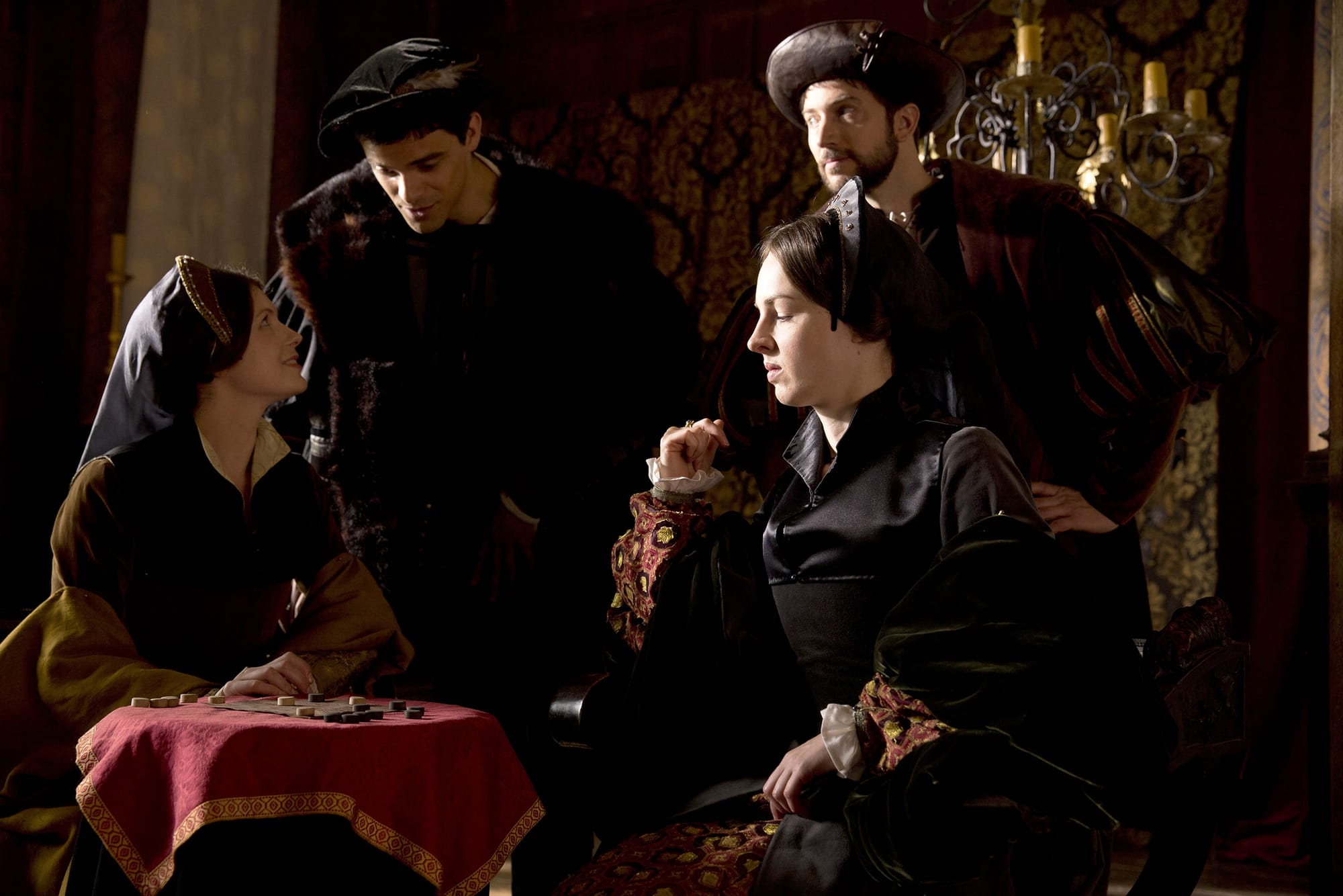 Charity Wakefield as Mary Boleyn, Jessica Raine as Jane Rochford, Jacob Fortune-Lloyd as Francis Weston, Edward Holcroft as George Rochford in 'Wolf Hall' Season 1