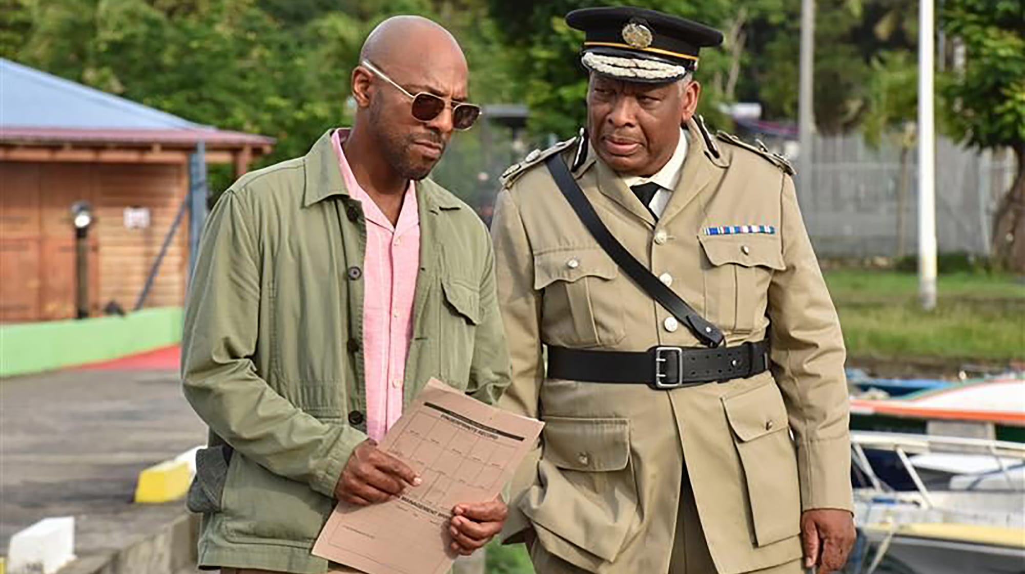 Don Gilet as DI Mervin Wilson and Don Warrington as Commissioner Selwyn Patterson in 'Death in Paradise' Season 14