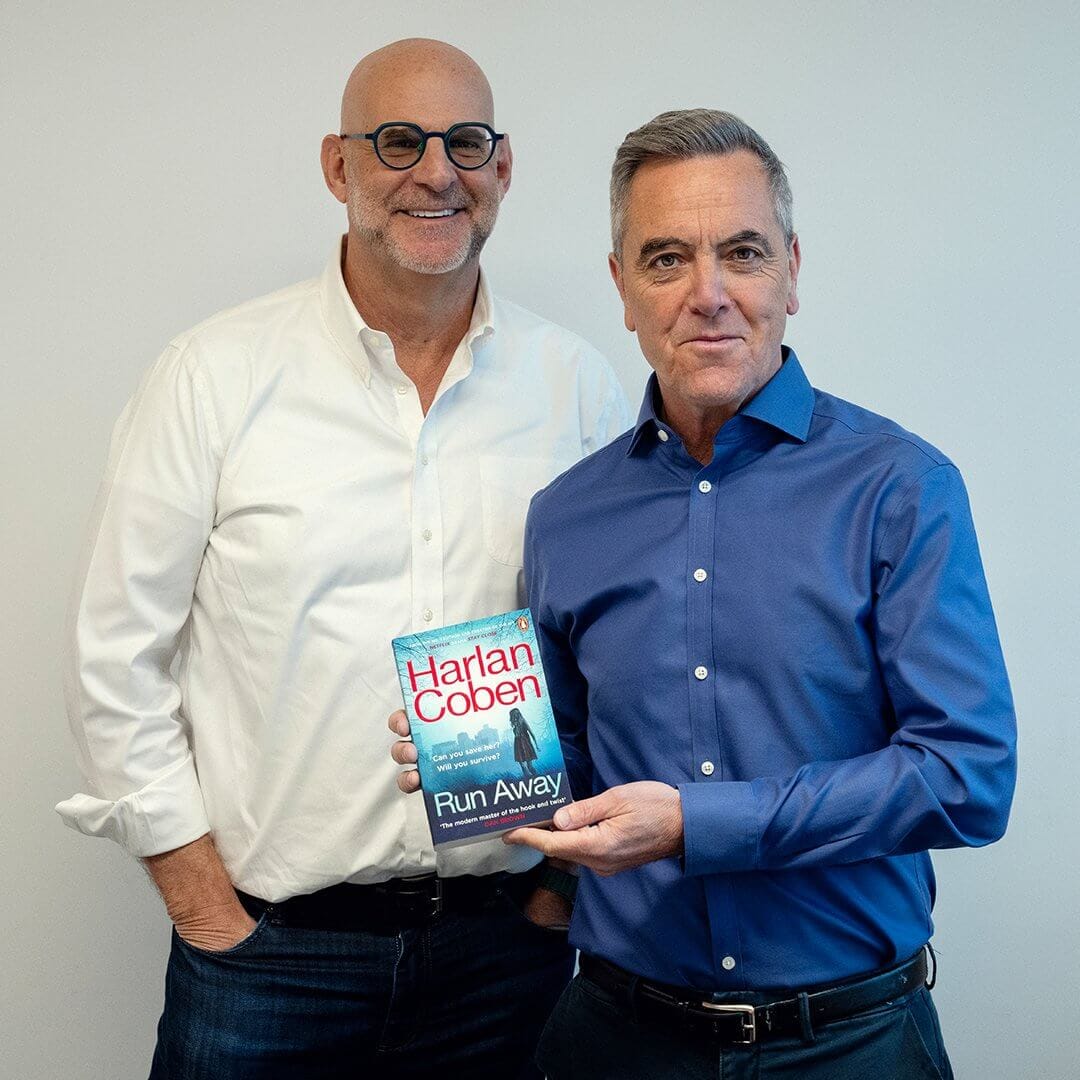 Harlan Coben and James Nesbitt pose with a copy of 'Run Away'