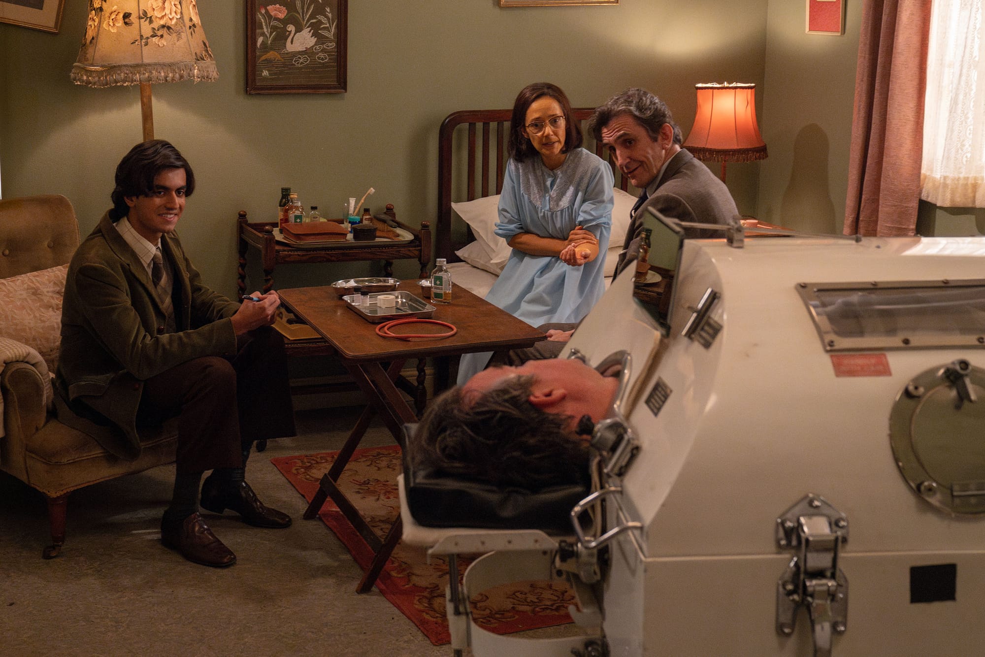 Eisa Latif as Harry Chopra, Sophie Bould as Betty Desmond, Stephen McGann as Dr. Patrick Turner, and Ben Owen-Jones as Owen Desmond in 'Call the Midwife' Season 14